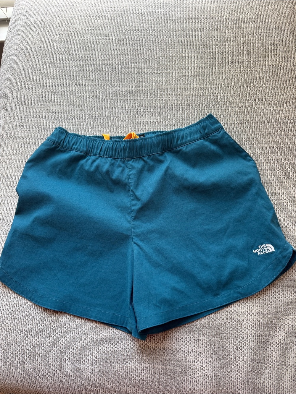 The North Face Women's Teal Blue Athletic Shorts with Yellow Drawcord